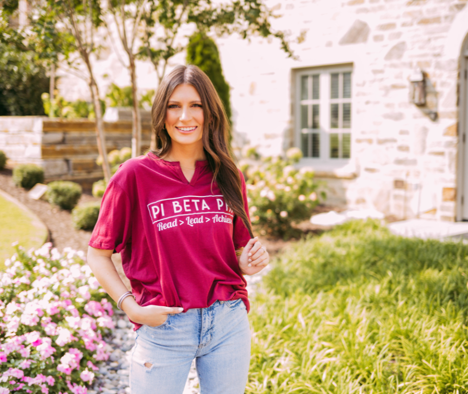 Girl wears a red shirt that reads,