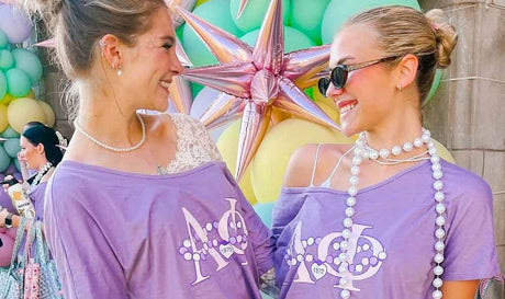 purple Alpha Phi T-shirts at a sorority-themed event