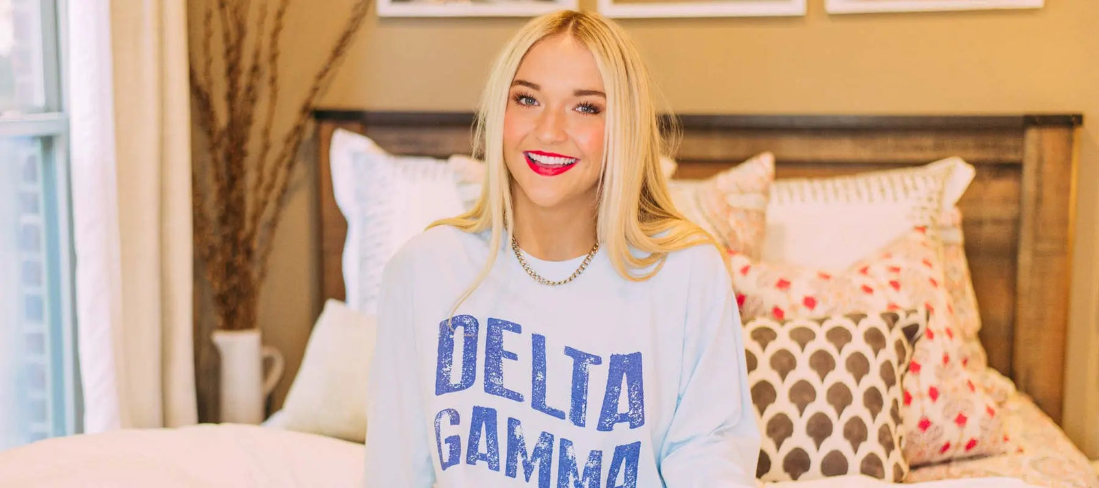 Girl wears a light blue DG long sleeve