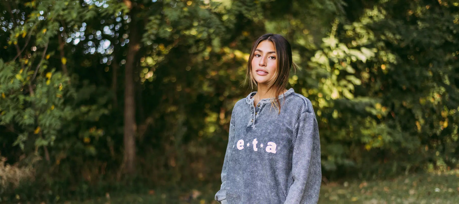 Girl wears a Zeta charcoal corduroy henley