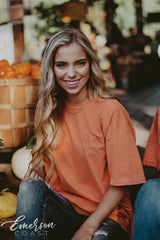 Girl wears orange ADPi Halloween Tshirt.