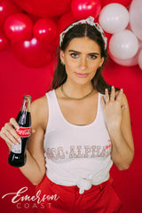 Girl wears white tank with 1-800-Alpha-Xi written across it.